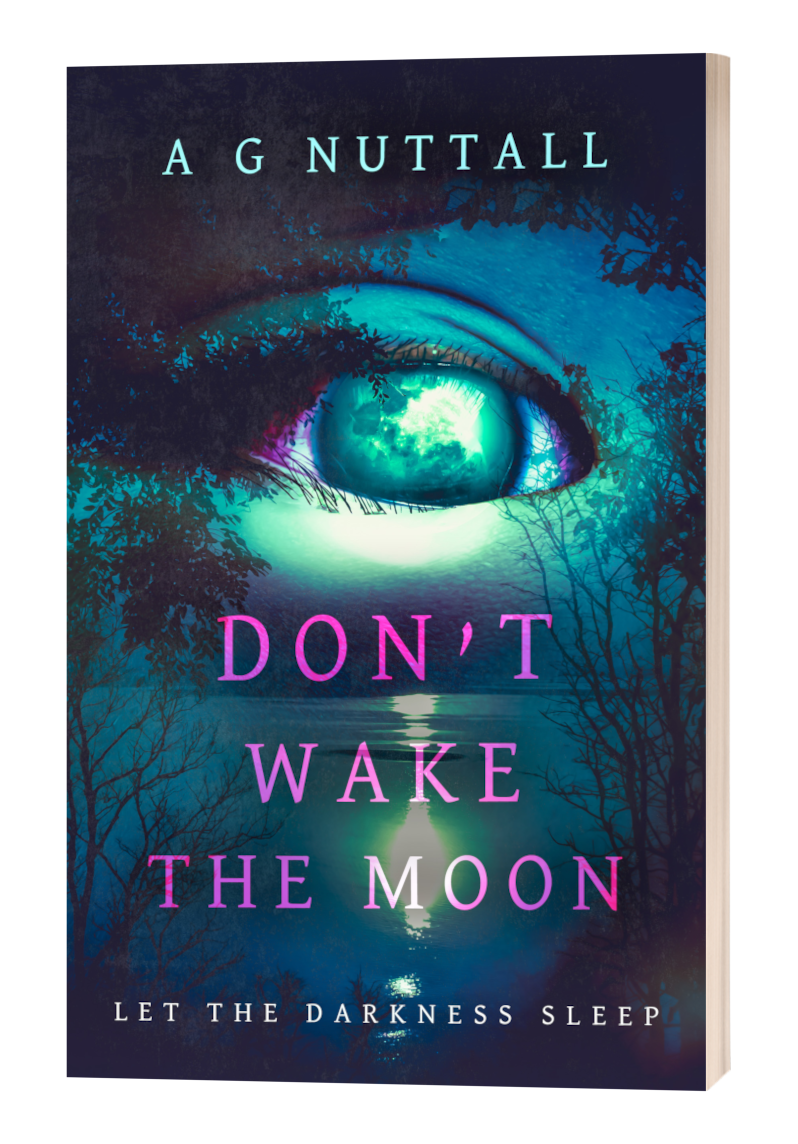 Cover of the book ‘Don’t Wake the Moon’ by A G Nuttall. A surreal, teal and purple-toned design shows a large, glowing eye seamlessly blended into a moonlit night sky over a dark lake surrounded by trees. The title is in bold pink letters, with the tagline ‘Let the Darkness Sleep’ at the bottom.